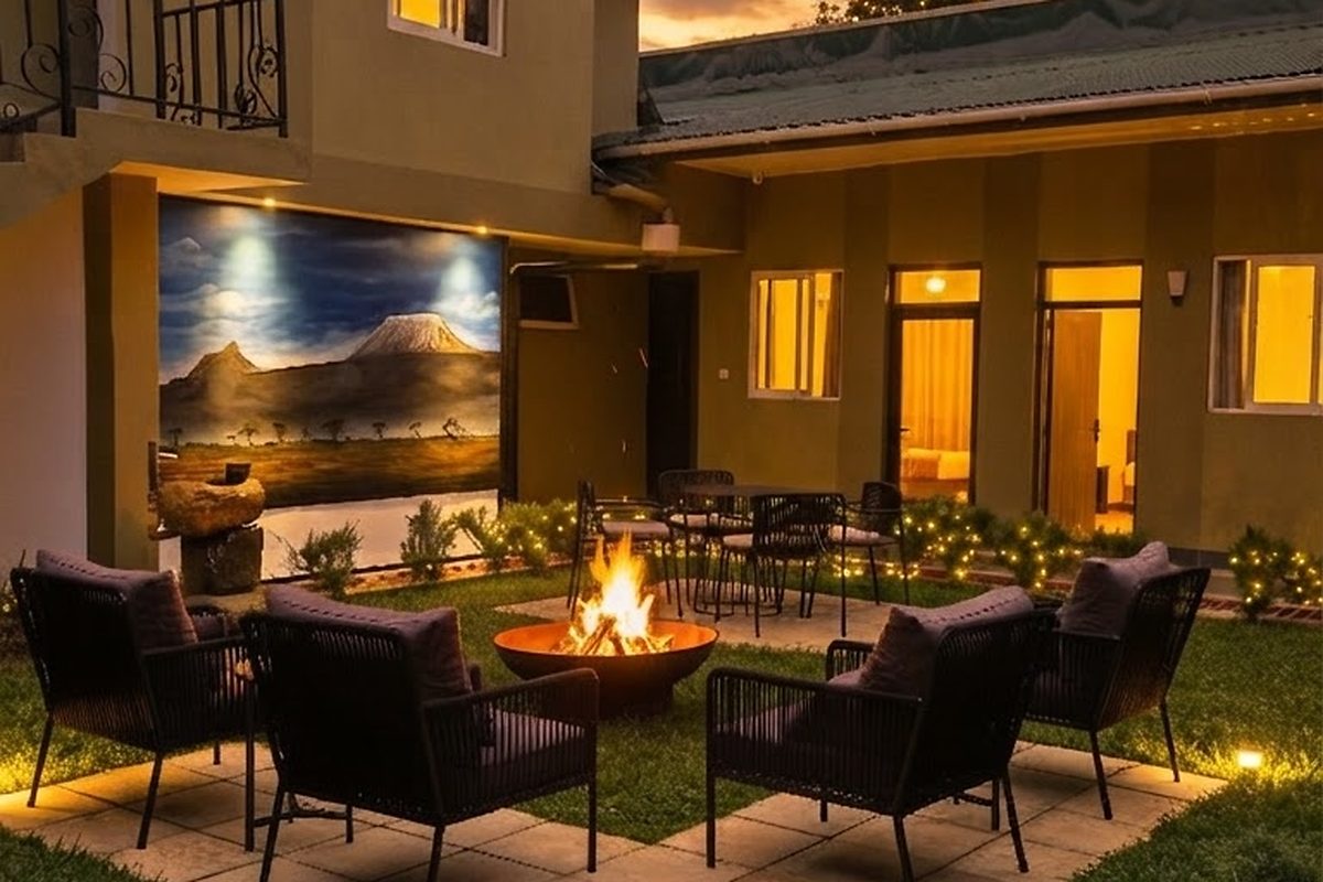 The courtyard, with seating on the lawn and rooms opening onto it
